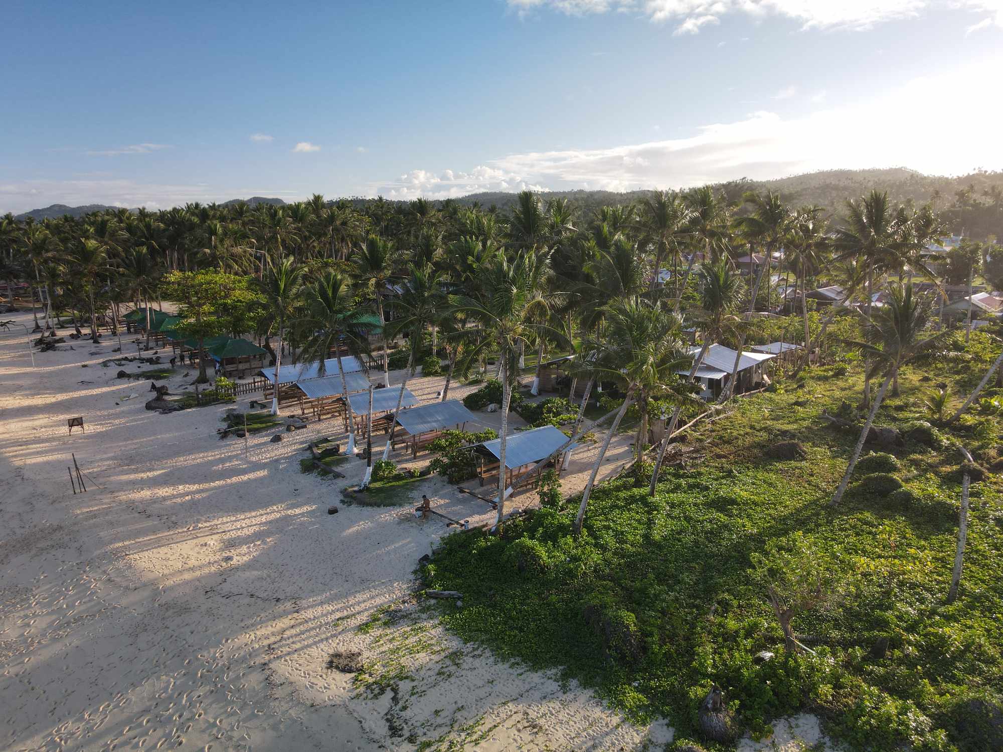 Aerial view of 3B Resort in its palm garden